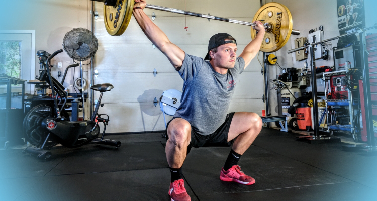 Weight Training The Muscle-Building Advantage - a man squats with a barbell