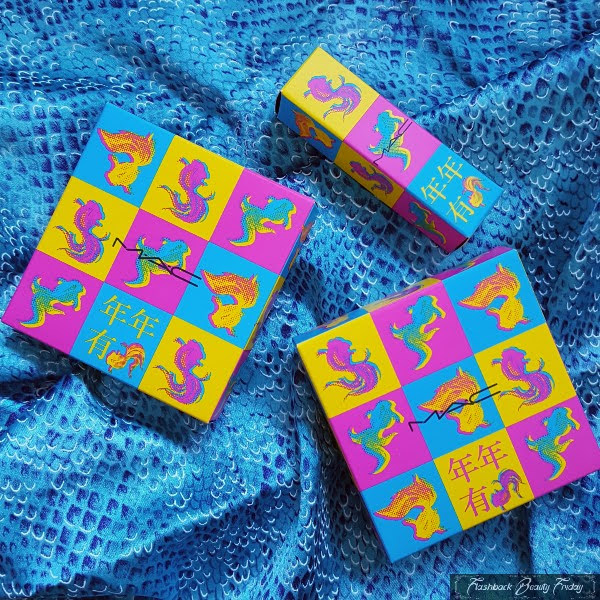 bright pop art MAC makeup boxes on blue fish scale fabric