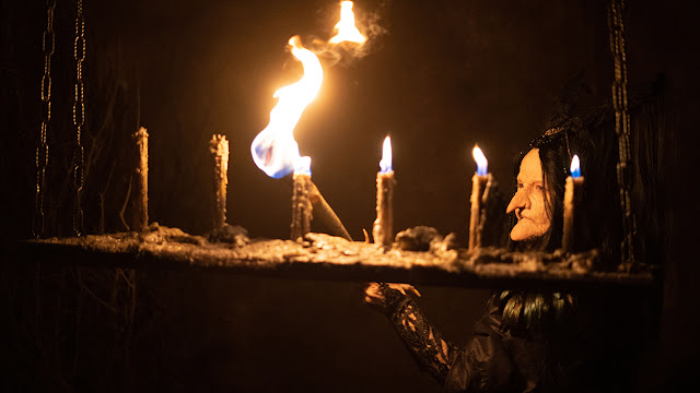 a german witch with candles