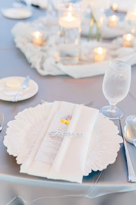 white reef charger with white napkin and menu