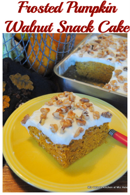 This photo shows a piece of Frosted Walnut Pumpkin Snack Cake on a plate. 