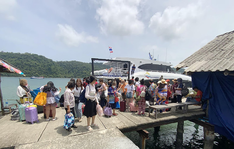 Tourists disembark, chasing Thai island paradise; fragile tourism boom vulnerable.