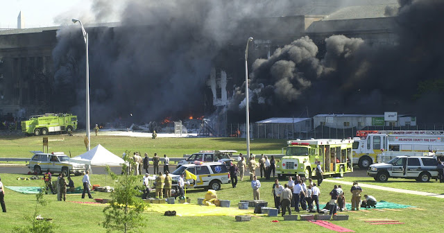 Emergency response teams begin preparing triage areas outside of the Pentagon following the attack, 11 September 2001. (Photo credit: Alexandria, Va.   Fire Department)