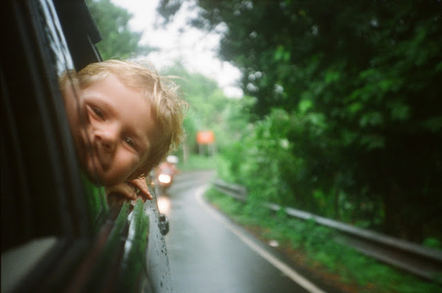 kid in car, kid looking out window, child in car, car ride