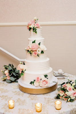 five tier white wedding cake with flowers