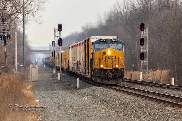 CSXT 3080 leads Q367-11 west at CP308, while L030-11 waits in the background