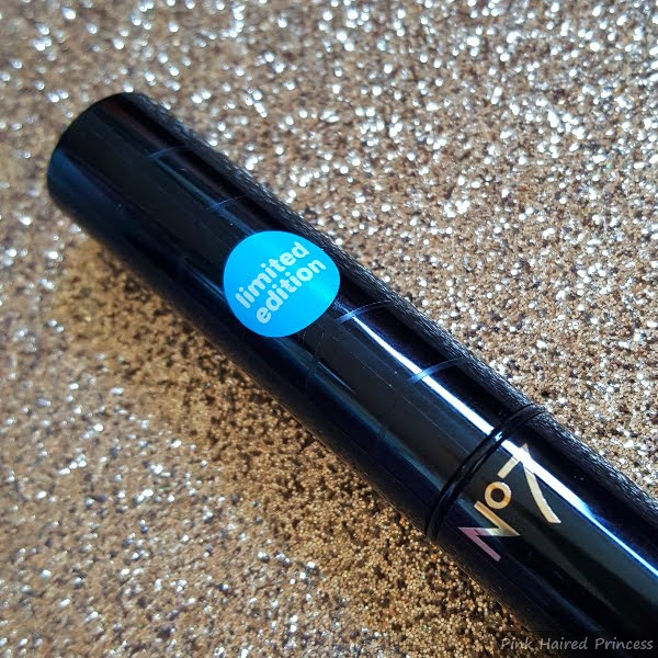 close up of glossy black lid of lipstick with swirl pattern and limited edition sticker