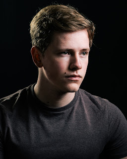 Studio headshot of a young young actor low key lighting