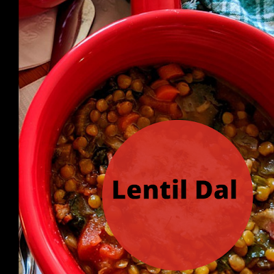 a red bowl filled with lentil dal, vegan,