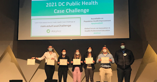 Students from the Uniformed Services University of the Health Sciences (USU) accept their award after winning the annual DC Public Health Case Challenge grand prize in late October. (Photo Credit: Courtesy of Weyinshet Gossa)