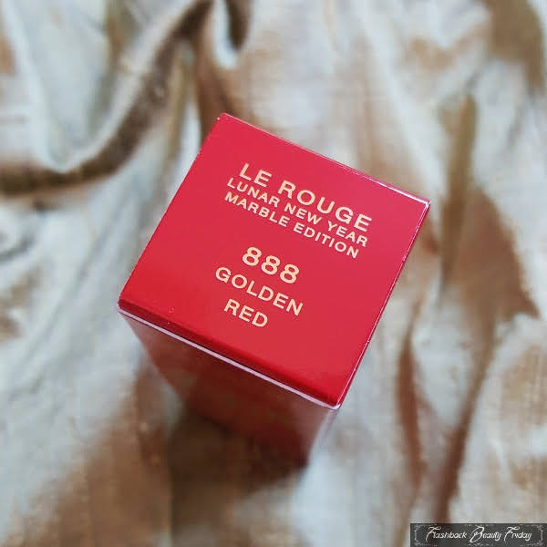 top of red lipstick box with gold lettering saying Givenchy Le Rouge Lunar New Year, Marble Edition 888 Golden Red