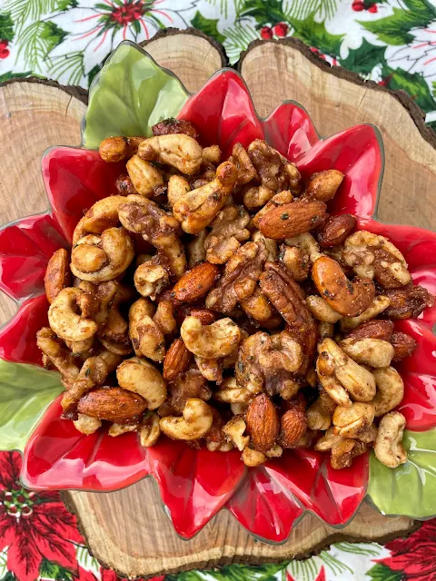 Bowl of sweet and spiced glazed mixed nuts.