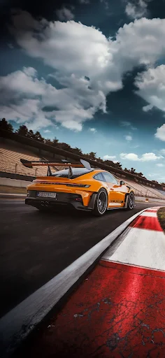 Orange sports car racing on track