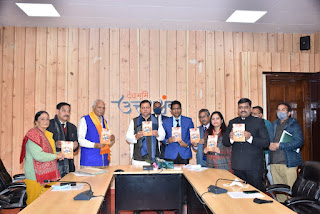 CM Uttarakhand reveal book on prevention from covid