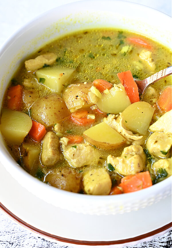 a white bowl with one pot chicken stew