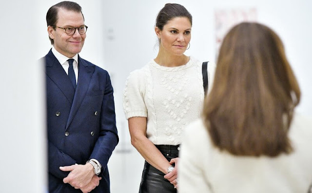 Crown Princess Victoria wore a merino cable knit sweater from & Other Stories. Alexandre de Paris large clip. Leather skirts