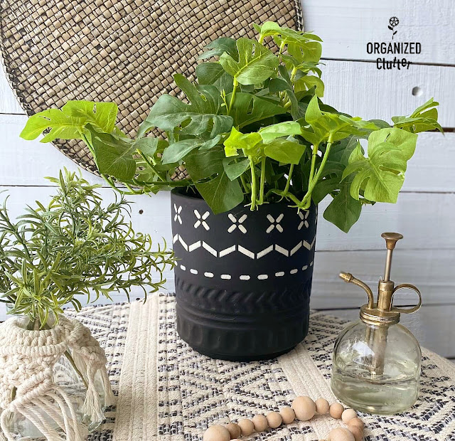Photo of a thrifted flower pot makeover with Dixie Belle's Caviar Chalk Paint & a stencil from Old Sign Stencils.