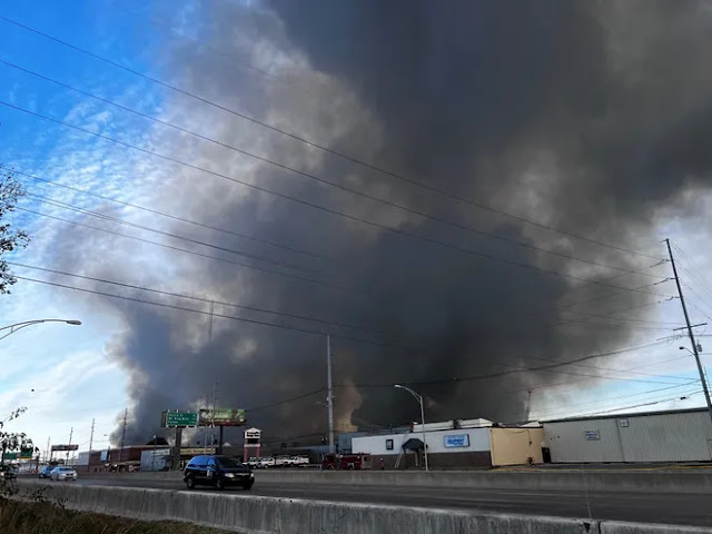 A massive warehouse fire in Evansville blocks Lloyd Expressway and necessitates the assistance of many firefighters.