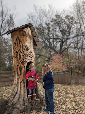 a girl and her grandmother play at the treetop adventure at Arbor Day Farm