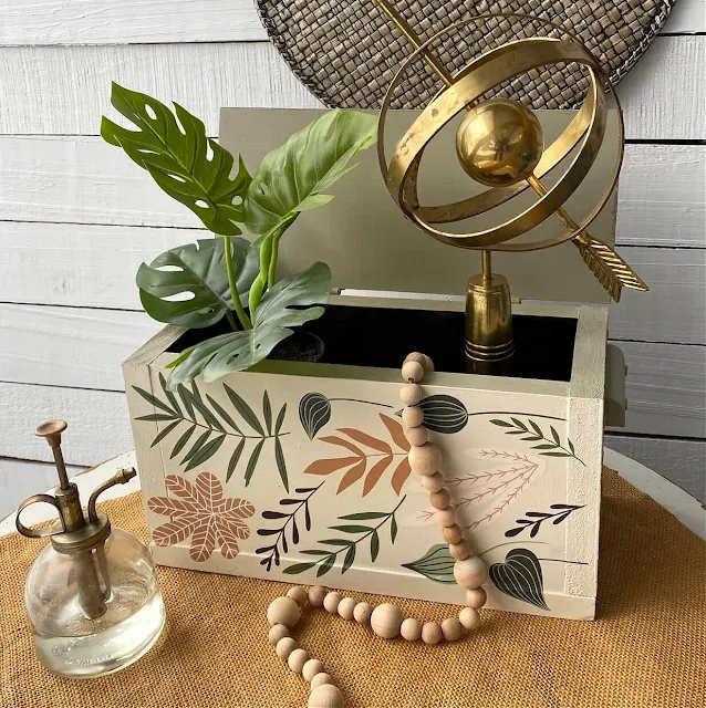 Photo of a thrifted wooden box upcycled with Dixie Belle Chalk Dried Sage and Drop Cloth Paint and Redesign with Prima Greenery House Decor Transfer.