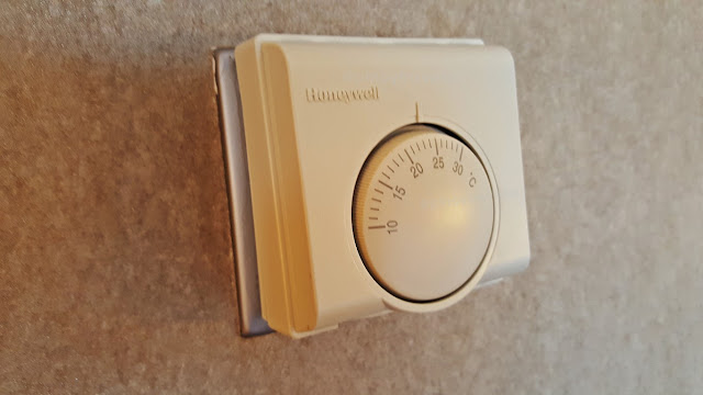 air-condition old thermostat dial at swissotel the stamford singapore