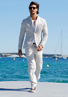 white coat pant walking image on sea boat, black specs