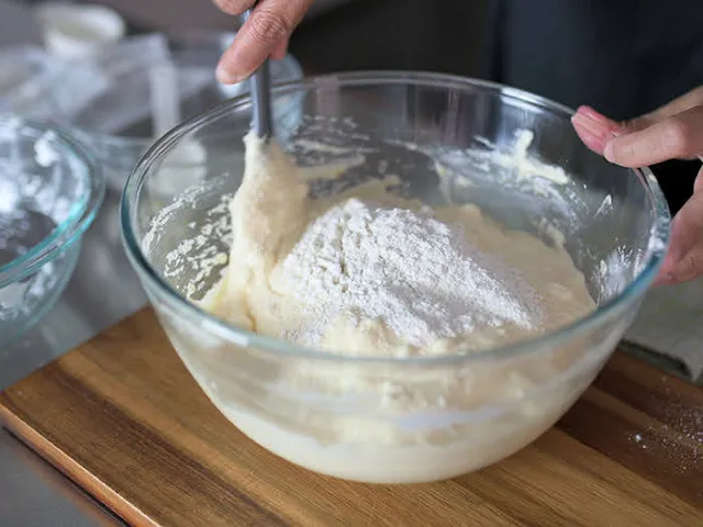 Add flour in 3 batches and gently mix after every flour addition.