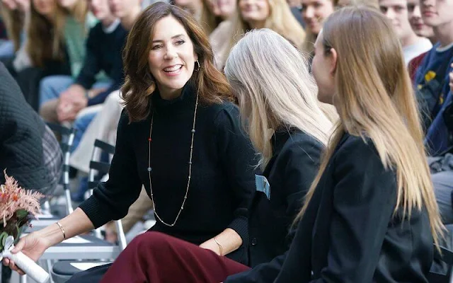 Crown Princess Mary wore a wool sweater by Co. Dulong delphis earrings and esme bracelet. Rebekka Notkin bracelet