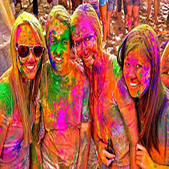 The four girls are celebrating holi in India