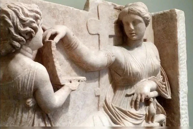 Ancient greek carved statue, relief of a laptop and a sevant girl Oopart.