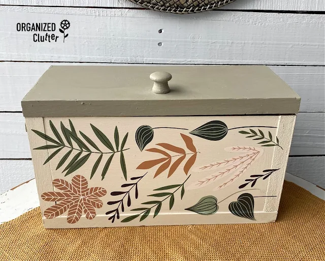Photo of a thrifted wooden box upcycled with Dixie Belle Chalk Dried Sage and Drop Cloth Paint and Redesign with Prima Greenery House Decor Transfer.