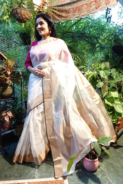 Monochrome Kota Doria saree with rose gold border and pallu.