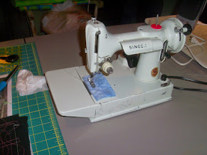 My mom's old Kenmore sewing machine skips stitches unless electrical tape  is placed under the pressure foot like so. The feed dogs are okay and the  machine is well oiled, what gives? 