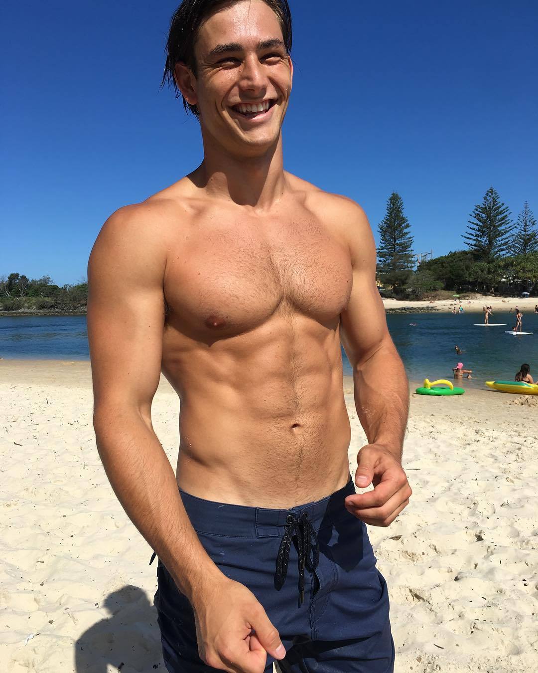 fit-hot-hairy-bare-chest-beach-guy-smiling