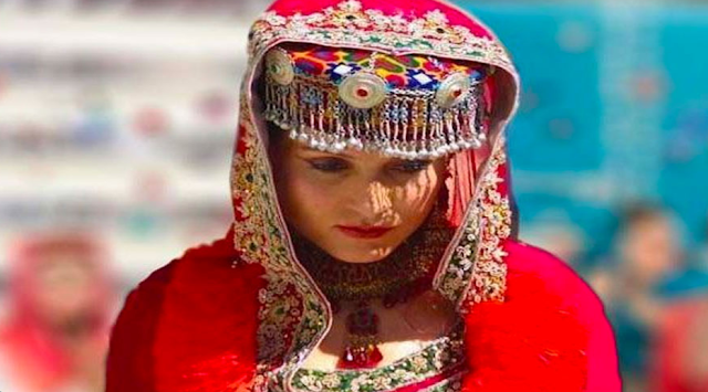 Iraghi Phartsun is a type of cap that women of ______ wear.