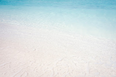 Blue waves on yellow sand