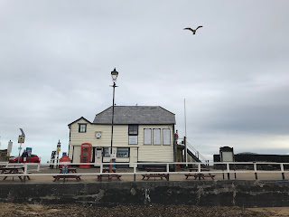 A picture of a large, white wooden building on the harbour at Broadstairs.  This is the Old Boathouse. Photo by Kevin Nosferatu for the Skulferatu Project.