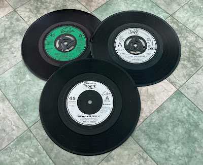 Three vinyl singles I bought in the 80s.