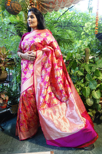 Fuschia pink Banarasi ektara silk saree with bouquet of flower motifs woven all across