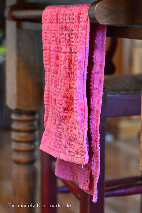 Red Kitchen towel hanging on table bar