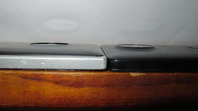 2014 Nokia Lumia 830 and 2015 Microsoft Lumia 950 XL facing upwards from the rear and with cover attached.
