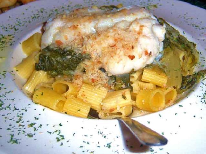 this is a dish or rigatoni with greens and haddock on top