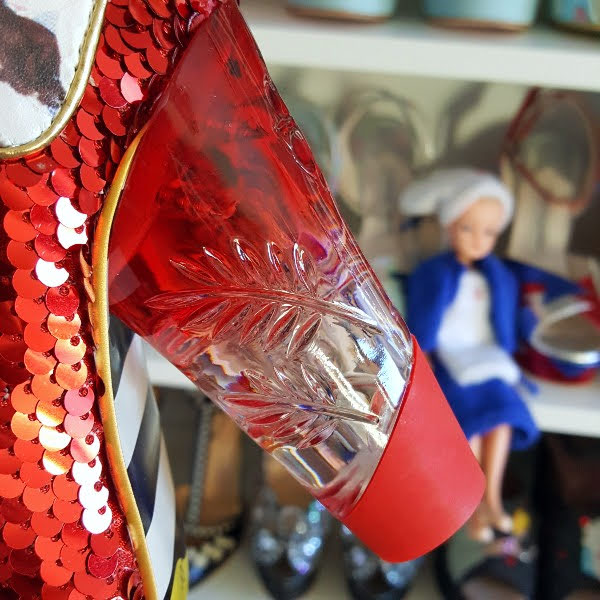 close up of red perspex ombre heel on shoe