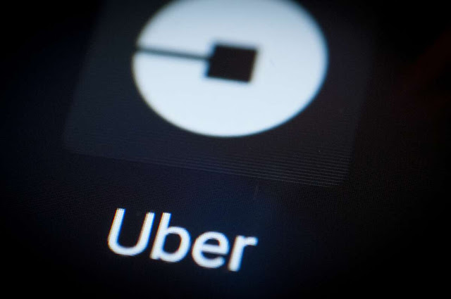 The Uber ride -hailing app is seen on an Android portable device.