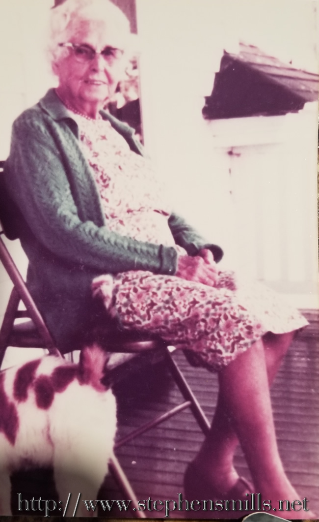 Later photograph of Ada Cox relaxing on the porch