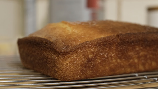 Vegan Lemon Drizzle Cake on a cooling rack