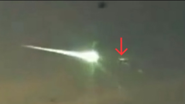 UFO literally destroys a meteorite flying in over the Earth.