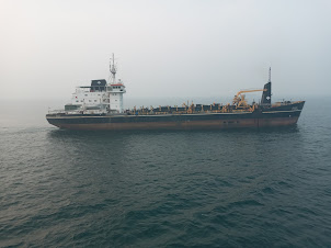 A " D.C.I " dredger passing alongside M.V.Kavaratti approaching Kochi harbour.