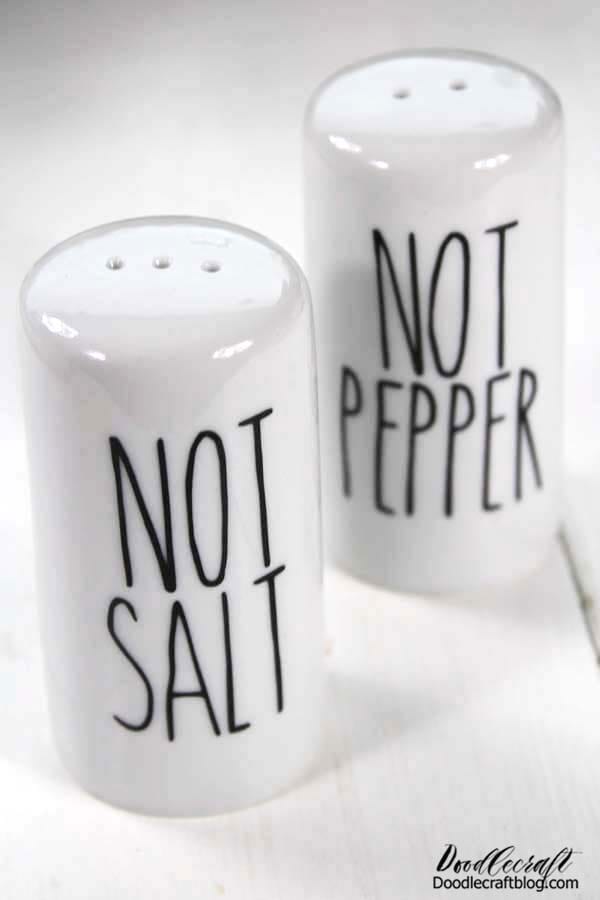 Rae Dunn Inspired Salt and Pepper Shakers DIY Make the perfect "Not Salt" and "Not Pepper" shakers for April Fool's day! This fun Rae Dun inspired craft is done easily with the Cricut and adhesive vinyl.   In just a few minutes you'll have the most confusing spice containers for a April Fool's day dinner, white elephant gift or just to be quirky!