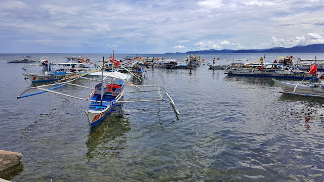 boats at the Sabang Boat Terminal, awaiting for their turn to load passengers and depart to the underground river